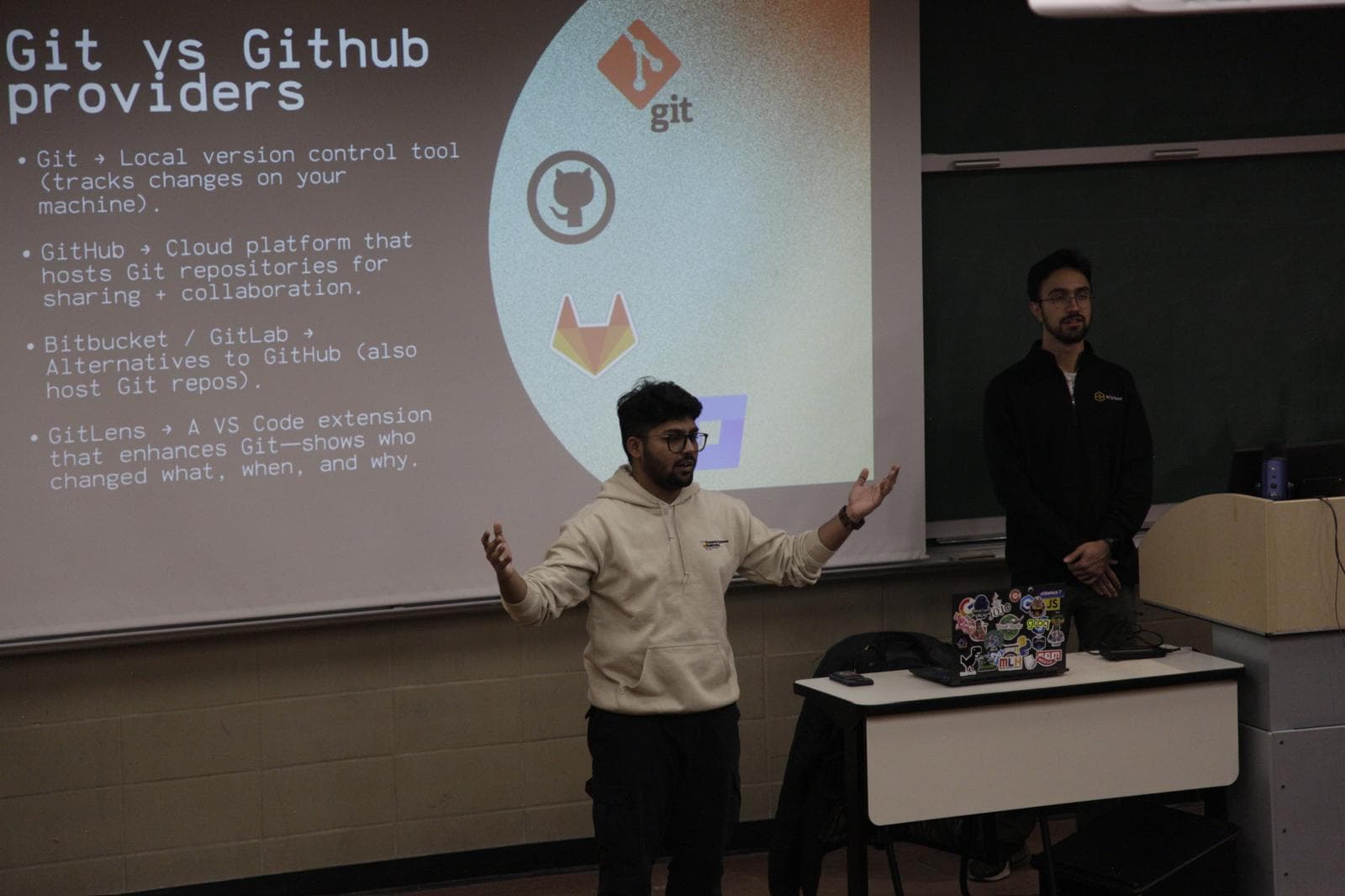 Presenting a Git vs GitHub slide in a lecture hall